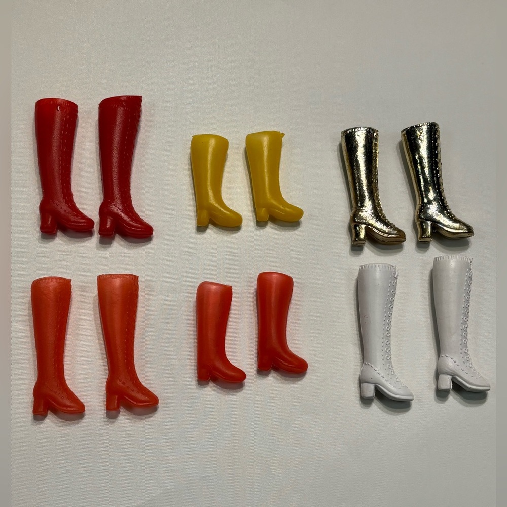 Set of multiple vintage 1970s Hong Kong-made plastic boots for dolls